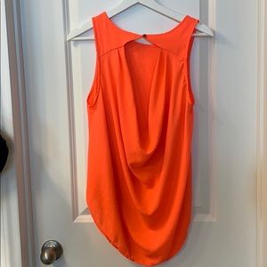 Neon orange blouse with open back